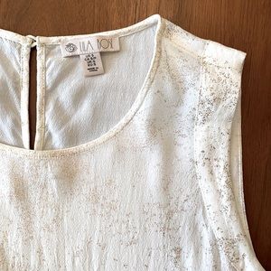 Sleeveless blouse with metallic rose gold texture